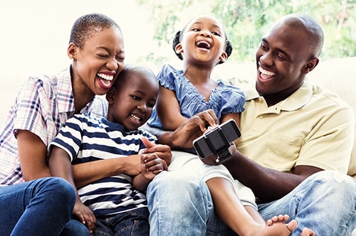 Happy Smiling Family On Couch N Min.jpg