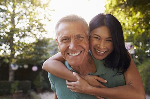 Portrait Of Loving Mature Couple In Back Yard Garden.jpg